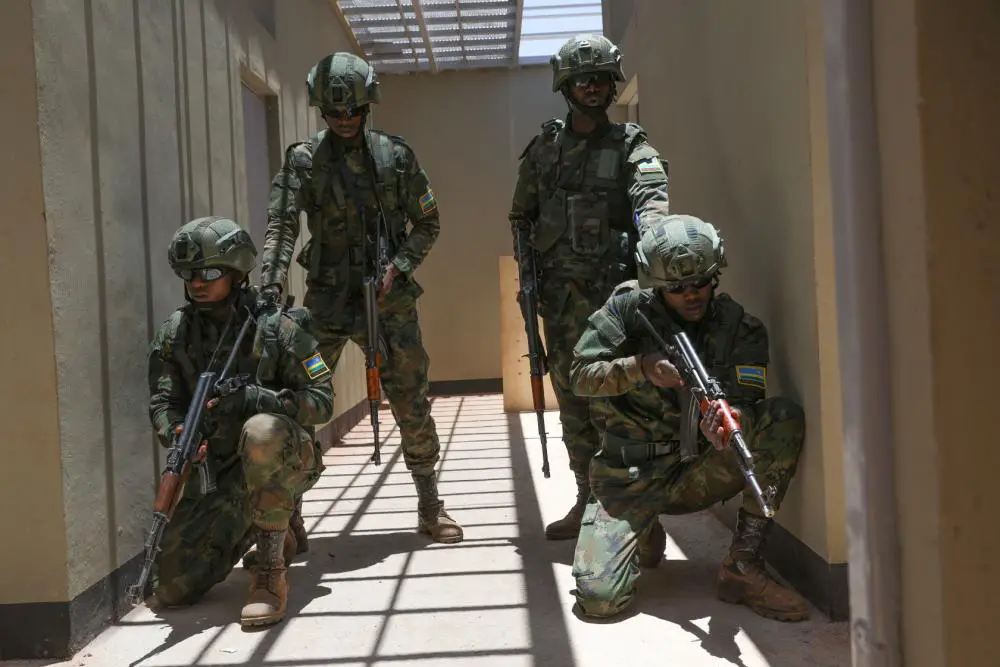 Rwanda Defence Force Soldiers take a tactical formation using four-man teams to enter and clear a room, March 11, 2022, in Isiolo, Kenya. Justified Accord takes place from Feb. 28 through Mar. 17 in Kenya. Over 800 personnel will participate in the exercise which focuses on enabling readiness for the U.S. and multinational partners.