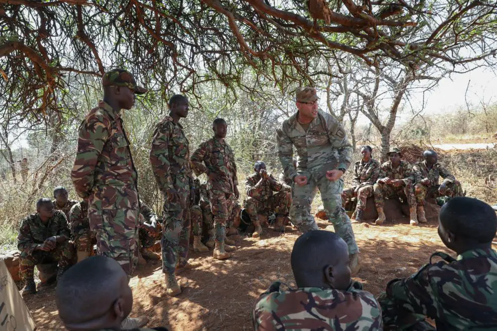 Kenya Defence Forces Soldiers discuss lessons learned from training that covered combative patrol movements with fire teams March 11, 2022, in Isiolo, Kenya. Justified Accord takes place from Feb. 28 through Mar. 17 in Kenya. Over 800 personnel will participate in the exercise which focuses on enabling readiness for the U.S. and multinational partners. 