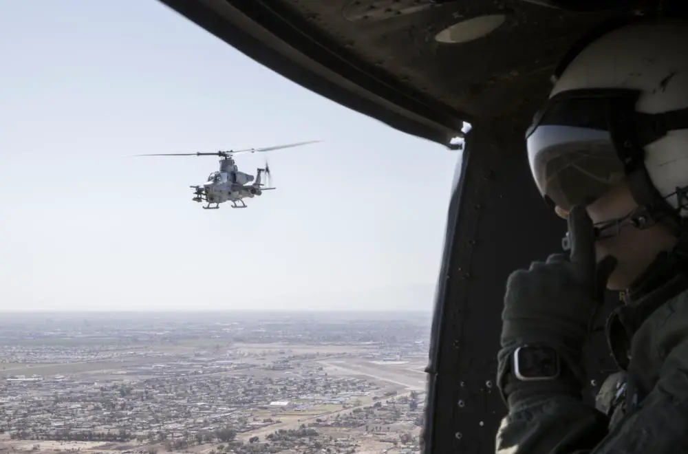 U.S. Marine Corps Cpl. Janae Jarnagin, crew chief, Marine Operational and Test Evaluation Squadron 1 (VMX-1), observes Strike Coordination and Reconnaissance Training from a UH-1Y Venom, near El Centro, California, March 10, 2022.