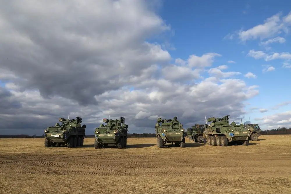 Maneuver Short Range Air Defense Strykers prototypes from the 5th Battalion, 4th Air Defense Artillery Regiment are staged in preparation for air defense training exercise in BPTA, Poland, Feb. 25, 2022. This is the first exercise debut of the four prototype M-SHORAD Strykers. (U.S. National Guard photo by Staff Sgt. Clinton Thompson)