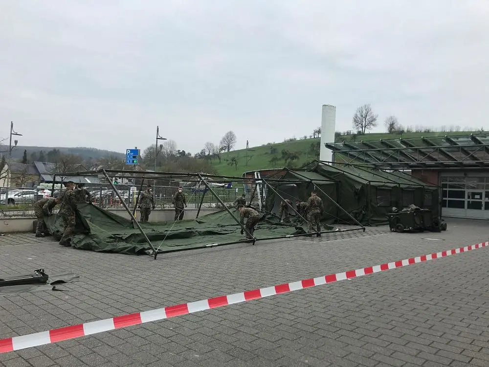 The Luxembourg Armed Forces (Luxembourgish: Lëtzebuerger Arméi members set up tents
