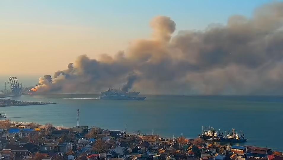 One landing ship tank was shown consumed by fire as two other landing ship tanks fled at least one of which also appeared to be on fire though was able to escape the port