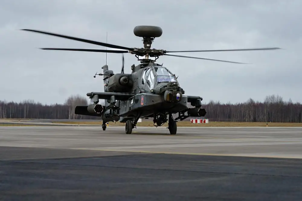 An AH-64D Apache Longbow helicopter assigned to 1-3rd Attack Battalion, 12th Combat Aviation Brigade, arrives at Lielvarde Military Airfield, Latvia, Feb. 24, 2022. 