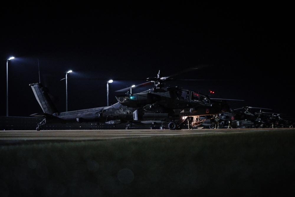 Nearly 20 AH-64D Apache Longbow helicopters assigned to 1-3rd Attack Battalion, 12th Combat Aviation Brigade, arrive at Lielvarde Military Airfield, Latvia, Feb. 24, 2022. 