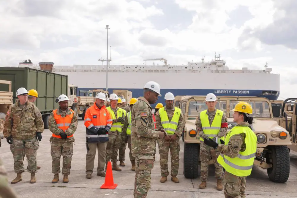 U.S. Army Maj. Gen. James Smith (left), commander of 21st Theater Sustainment Command, receives a brief from 1st Lt. Jasmine Jackson, executive officer of 635th Movement Control Team, 39th Transportation Battalion, at a commercial port at Alexandroupoli, Greece, March 21, 2022.