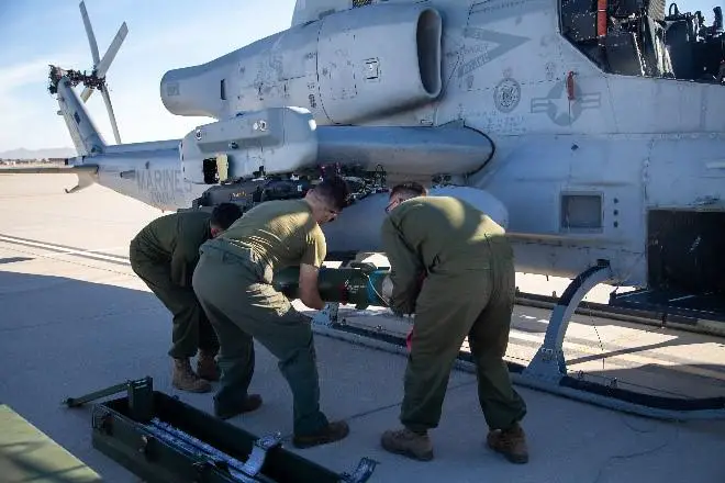 U.S. Marines with Marine Operational Test and Evaluation Squadron 1 (VMX-1) load a joint air-to-ground missile (JAGM) onto an AH-1Z Viper during an operational test at Marine Corps Air Station Yuma, Arizona, Dec. 6, 2021. 
