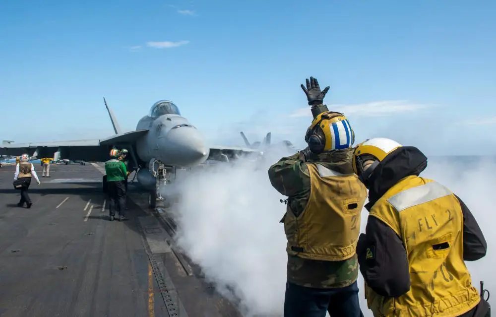 Sailors prepare an F/A-18E Super Hornet, attached to the “Blue Blasters” of Strike Fighter Squadron (VFA) 34, to launch from the flight deck of the Nimitz-class aircraft carrier USS Harry S. Truman (CVN 75), in support of Exercise INIOCHOS 22, April 1, 2022.