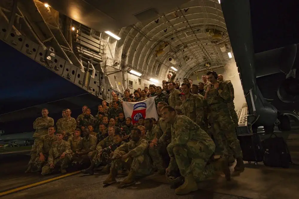 U.S. Army Paratroopers and the Indonesian Army pose for a group photo before boarding a U.S. Air Force Boeing C-17 Globemaster III  prior to a joint forcible entry operation at the Baturaja Training Area, Indonesia, during Exercise Garuda Shield 21.