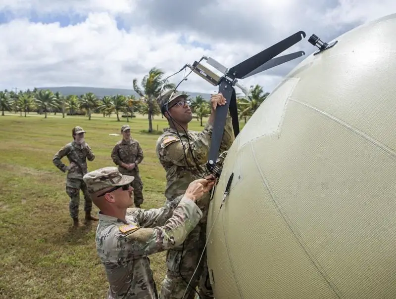 Signal Soldiers from 307th ESB-E emplace a satellite terminal to enable communications between the remote launcher and Tactical Fire Control Center. 