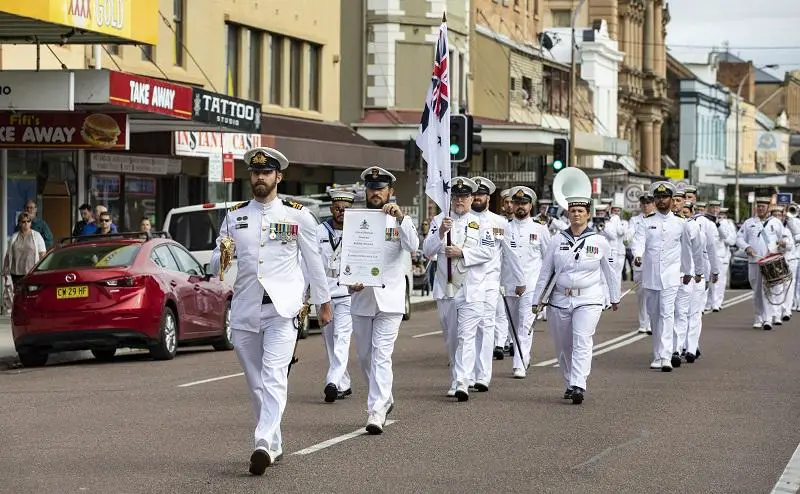 Commanding Officer of HMAS Maitland, Lieutenant Commander Jeremy Evain, leads the ship's company through the streets of Maitland, New South Wales, during the Freedom of Entry march on Saturday, 02 April.