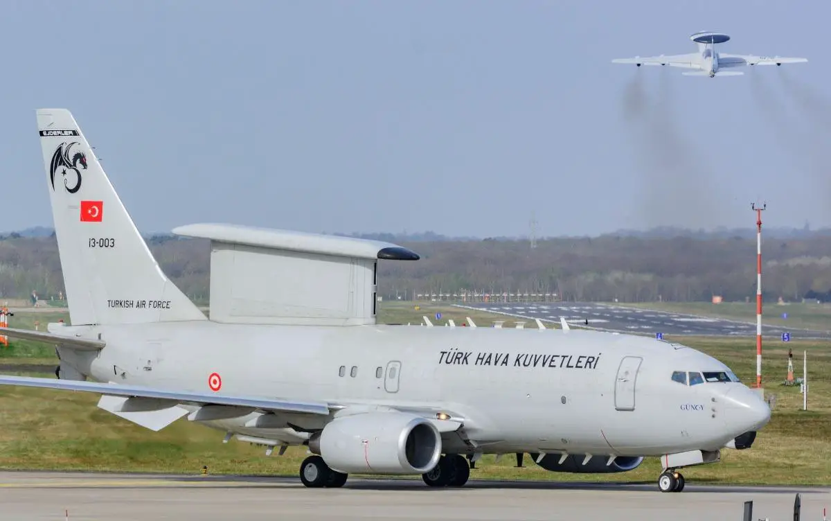 A Turkish Air Force E-7T at Geilenkirchen Air Base, Germany while an E-3A takes off in the background. 