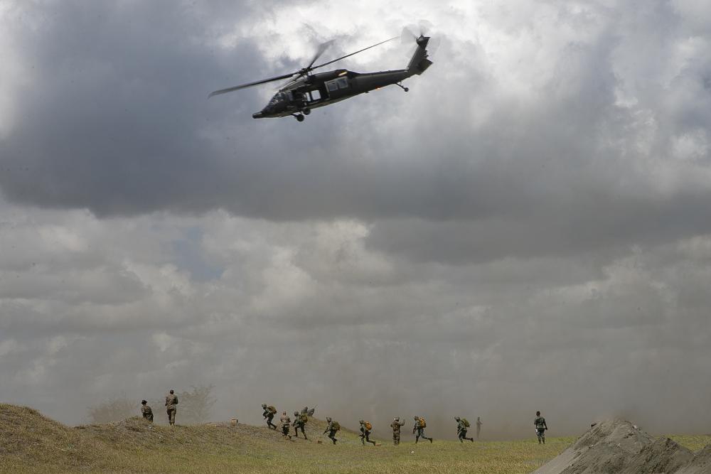 Philippine Marines secure an objective after inserting from a UH-60 Blackhawk during Balikatan 22 at Appari, Philippines
