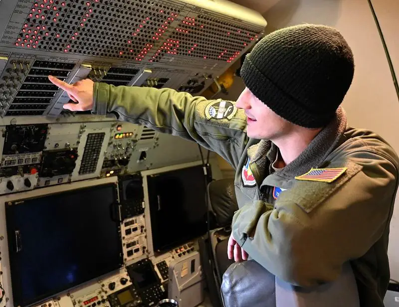 U.S. Air Force Technical Sgt. Aaron Cloutier, 605th Test and Evaluation Squadron, Detachment 1, communications systems development test manager, Tinker Air Force Base, Oklahoma executing historic E-3G in-flight test. 