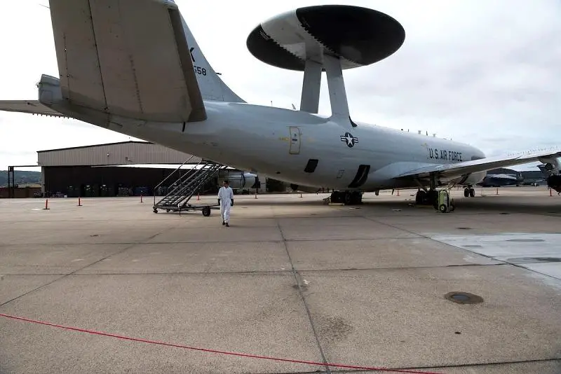 U.S. Air Force Senior Airman Ryan Kane, 552nd Aircraft Maintenance Squadron crew chief, stands in front of a Boeing E-3 Sentry aircraft on a flightline at Ramstein Air Base, Germany, Sept. 24, 2020. Kane was on stand-by awaiting a liquid nitrogen system to work on the Boeing E-3 Sentry aircraft’s life support system. 