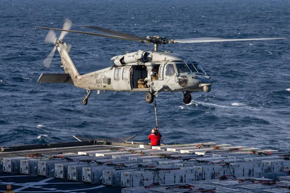An MH-60S Nighthawk, attached to the "Tridents" of Helicopter Sea Combat Squadron (HSC) 9, transports ammunition to USS Gerald R. Ford (CVN 78) during an ammunition on-load with USNS William McLean (T-AKE 12), April 9, 2022. 