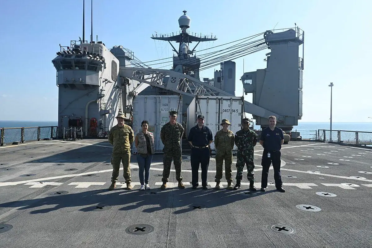 Australian, Indonesian, United States military and civilian personnel taking part in Exercise Crocodile Response 2022 on the flight deck of the United States Navy amphibious ship USS Ashland in Darwin, Northern Territory.