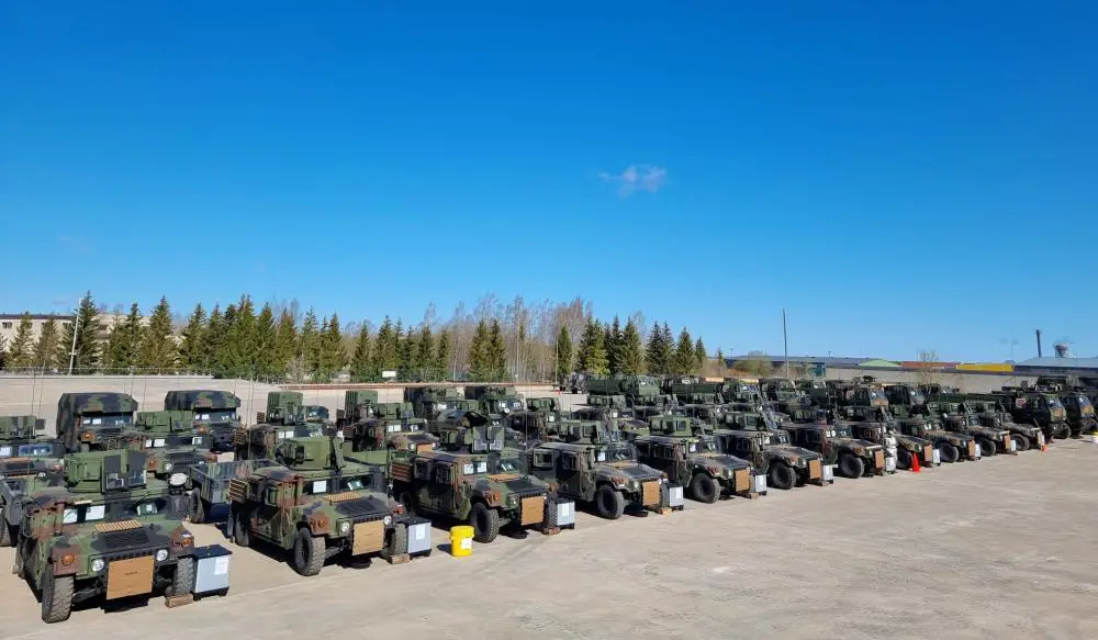 Humvees, tactical Humvee ambulances, 2.5-ton light utility trucks and other vehicles stand ready for issue to the 169th Field Artillery Brigade Headquarters at Tapa Barracks, Estonia.