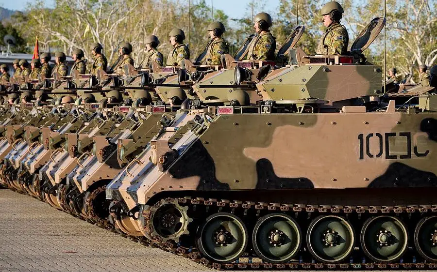 Australian Army soldiers from 2nd Cavalry Regiment line the parade ground in M113 armoured personnel carriers during the parade welcoming the regiment to 3rd Brigade at Lavarack Barracks in Townsville, Queensland.