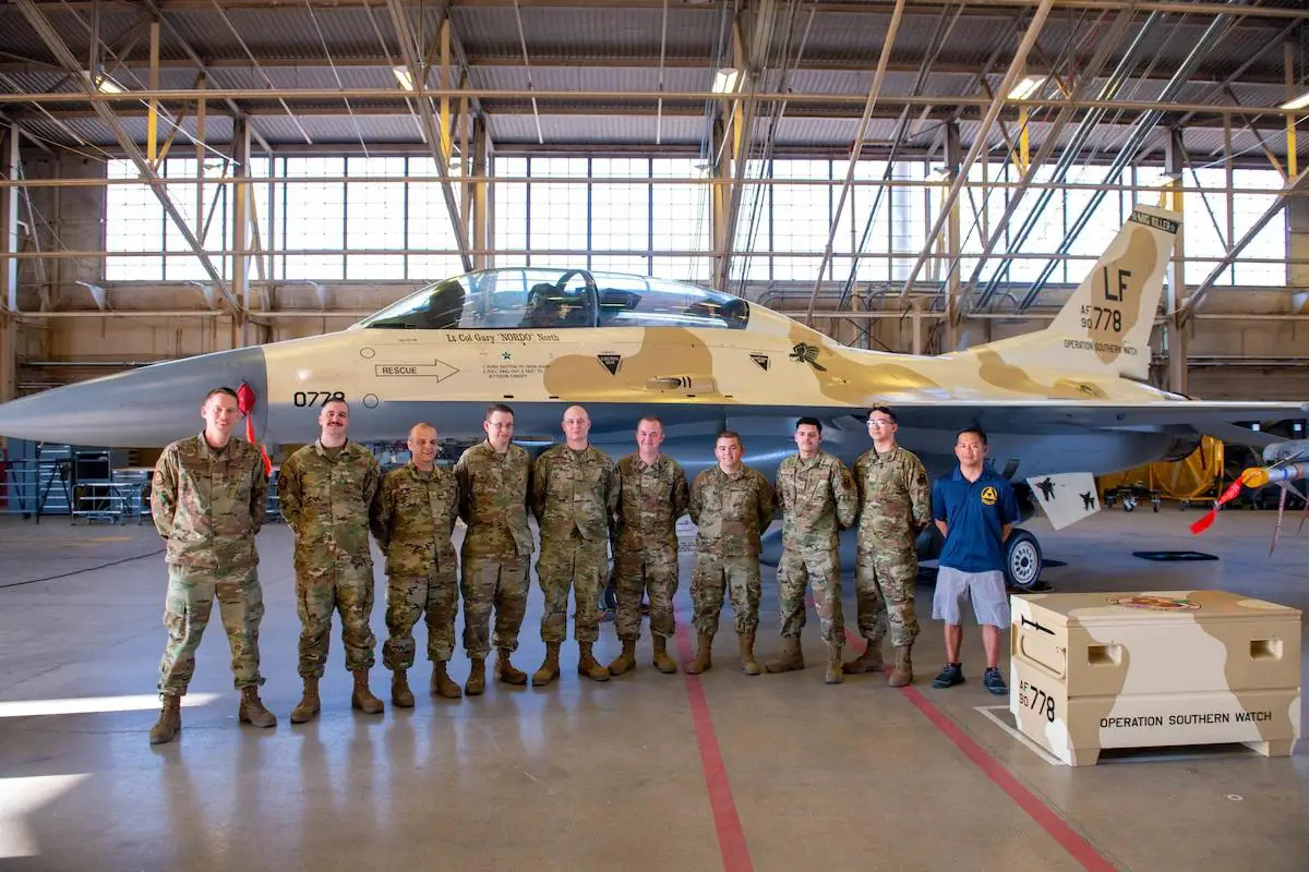 Members of the fabrication flight’s corrosion control team stand with their newly painted F-16D Fighting Falcon during an unveiling ceremony at the 310th Air Maintenance Unit hanger June 17, 2022, at Luke Air Force Base Phoenix, Arizona.