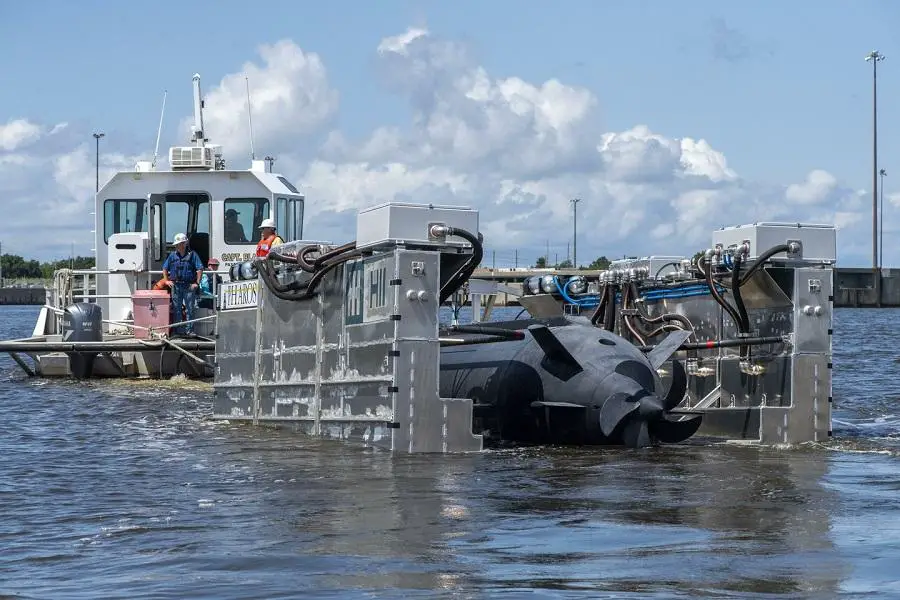 HII’s Pharos prototype platform being towed behind a small craft in the Pascagoula River while recovering HII’s Proteus LDUUV during a demonstration June 8, 2022.
