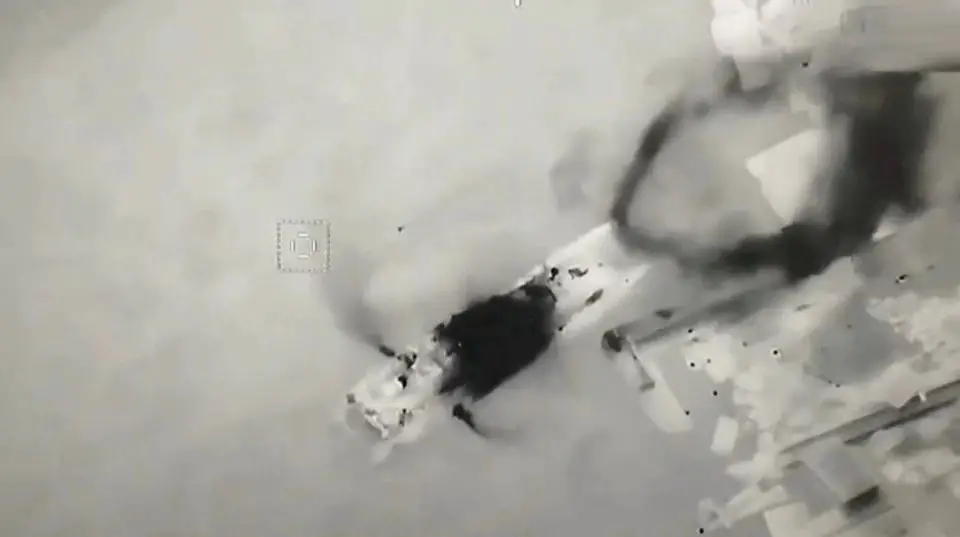 An aerial view shows Ukrainian UAV Bayraktar hitting Russian landing craft vessel with missiles, at Zmiinyi (Snake) Island, Ukraine, in this still image from a handout video released by Press service of Ukrainian Ground Forces on May 7, 2022.