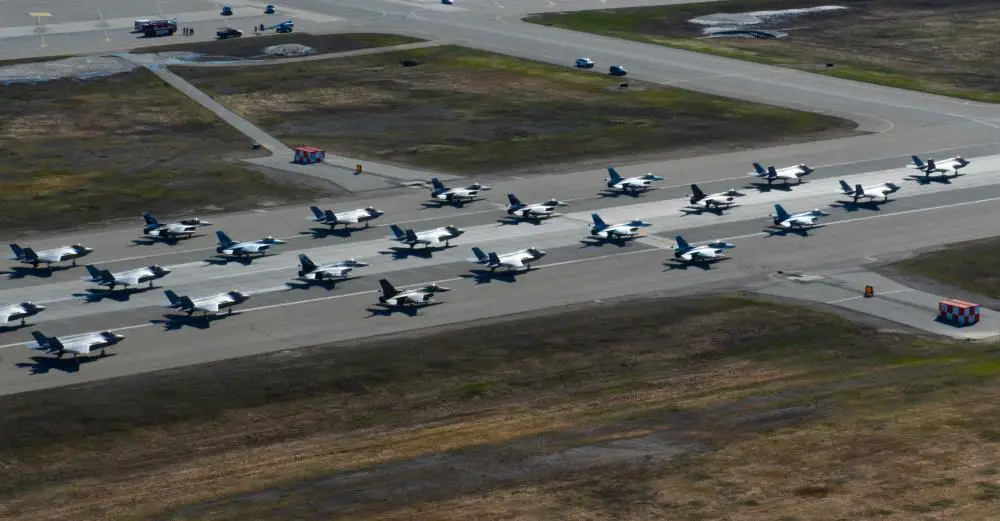 A formation of 48 F-35A Lightning IIs and 12 F-16s during a routine readiness exercise at Eielson Air Force Base, Alaska, March 25, 2022. The formation demonstrated the 354th Fighter Wing’s ability to rapidly mobilize fifth-generation aircraft in arctic conditions. (U.S. Air Force photo taken by Staff Sergeant Danielle Sukhlall)