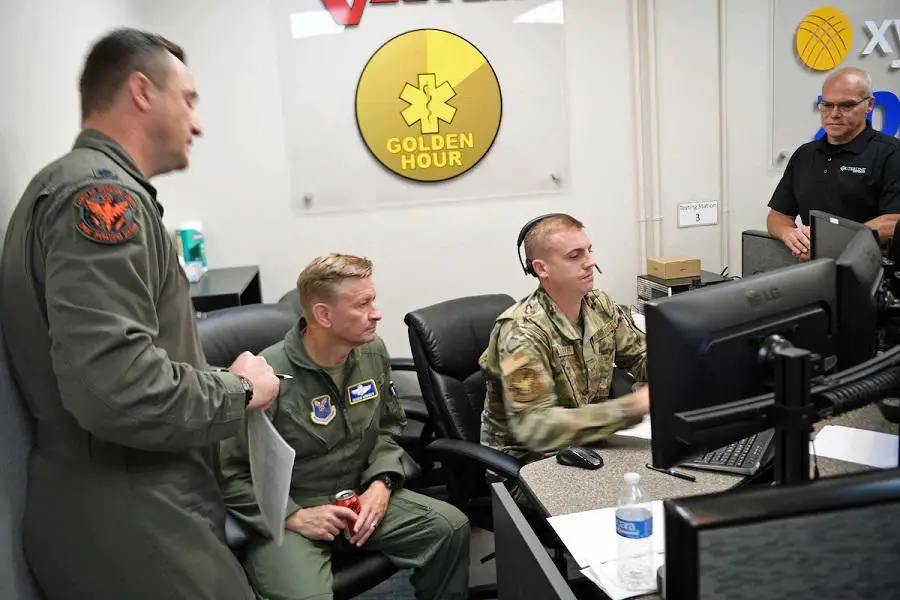 Staff Sgt. Kyle Snedeker, center-right, a tactical data link manager from the 608th Air Operations Center, shows Brig. Gen. Scheid Hodges, center-left, Mobilization Assistant to the 8th Air Force Commander, the B-52 route during an aerial demonstration of the new IRIS communications system. IRIS is a commercial off-the-shelf, beyond line of sight tool produced by Outerlink. The system would allow for bombers to relay data, voice and imagery information in near real time speeds.