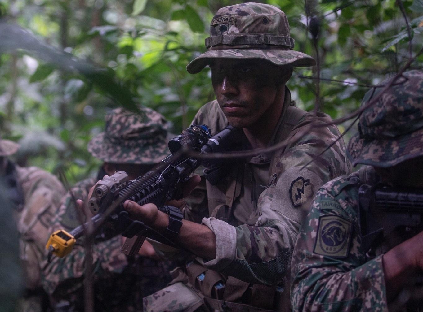 3-4 CAV Raiders and 4th Royal Malaysian Regiment patrol the jungle during a field training exercise as a part of Keris Strike 2022.