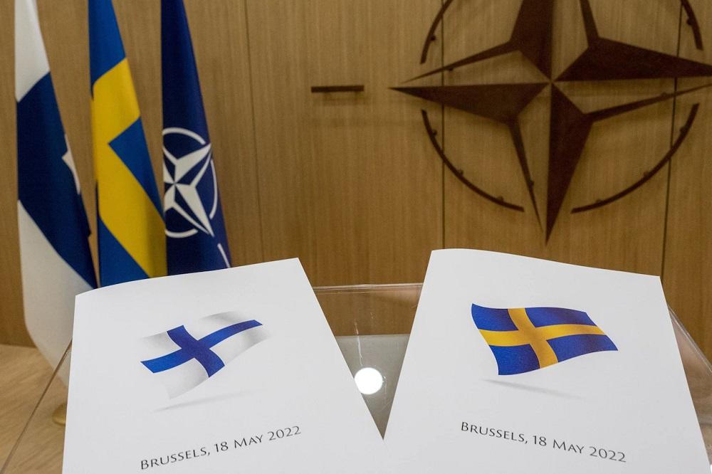 NATO Secretary General Jens Stoltenberg receives official letters of application to join NATO from Klaus Korhonen, ambassador of Finland accredited to NATO, and Axel Wernhoff, ambassador of Sweden accredited to NATO, in Brussels, May 18, 2022.