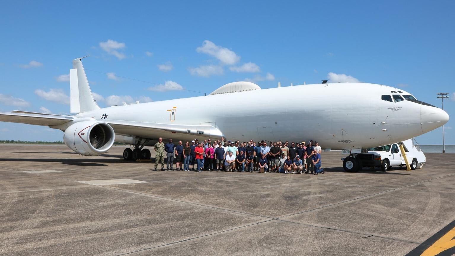 Members of PMA-271 along with industry partners pose with the first E-6B Mercury inducted under the new Integrated Maintenance and Modification Contract at Lake Charles, Louisiana, May 9. The new contract looks to decrease average turnaround times from 19 months to six months. 