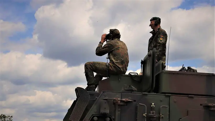 From a Fuchs armoured transport vehicle, Brigadier General Stephan Willer (left) and Major General Heico Hübner observe and evaluate the exercise