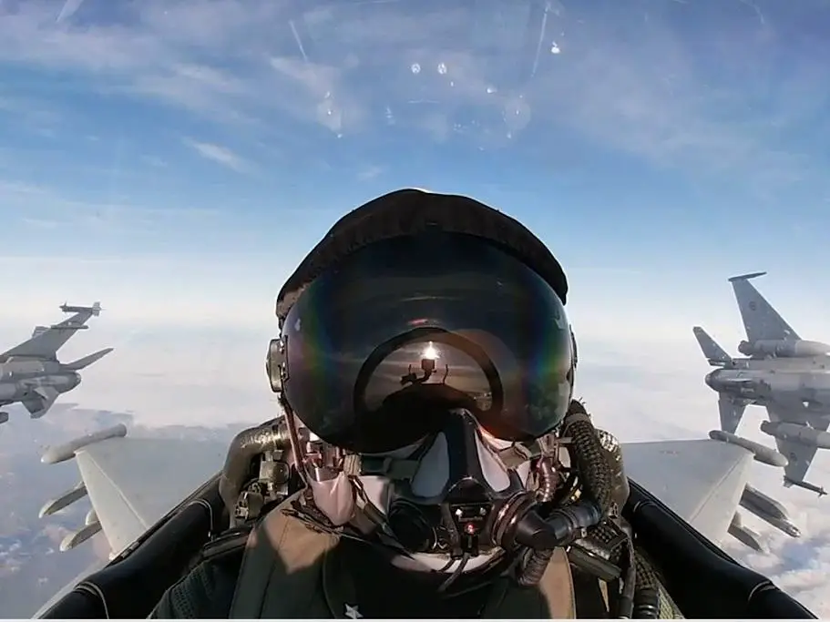 View from an Italian Air Force Eurofighter cockpit with two Romanian Air Force F-16s breaking during aerial manoevures in Romanian airspace