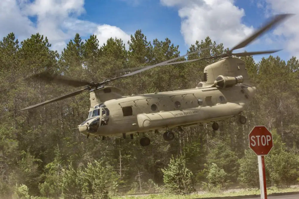 An CH-47 Chinook, with the 3-328th General Support Aviation Battalion, Selfridge Air National Guard, takes off from Michigan highway M-28 during Agile Combat Employment (ACE) training during Northern Agility-1 22 in Alger County, located in the Upper Peninsula of Mich., June 28, 2022.