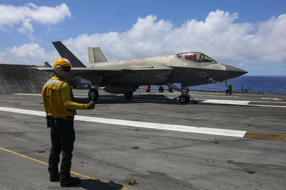 Aviation Boatswain’s Mate 3rd Class Julian Fernando directs an F-35C Lightning II, assigned to the "Black Knights" of Marine Fighter Attack Squadron (VMFA) 314, on the flight deck of the Nimitz-class aircraft carrier USS Abraham Lincoln (CVN 72). 