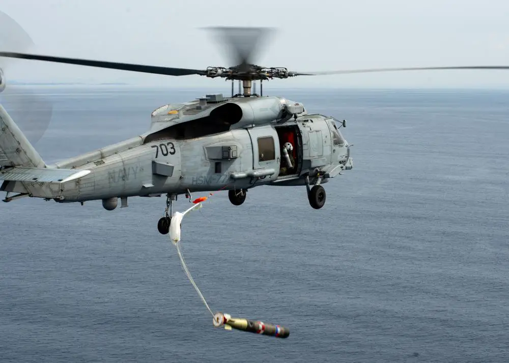 An MH-60R Seahawk, attached to the “Saberhawks” of Helicopter Maritime Strike Squadron (HSM) 77, drops a practice torpedo during the first torpedo exercise conducted by a U.S. Navy squadron alongside the Japan Maritime Self-Defense Force (JMSDF).