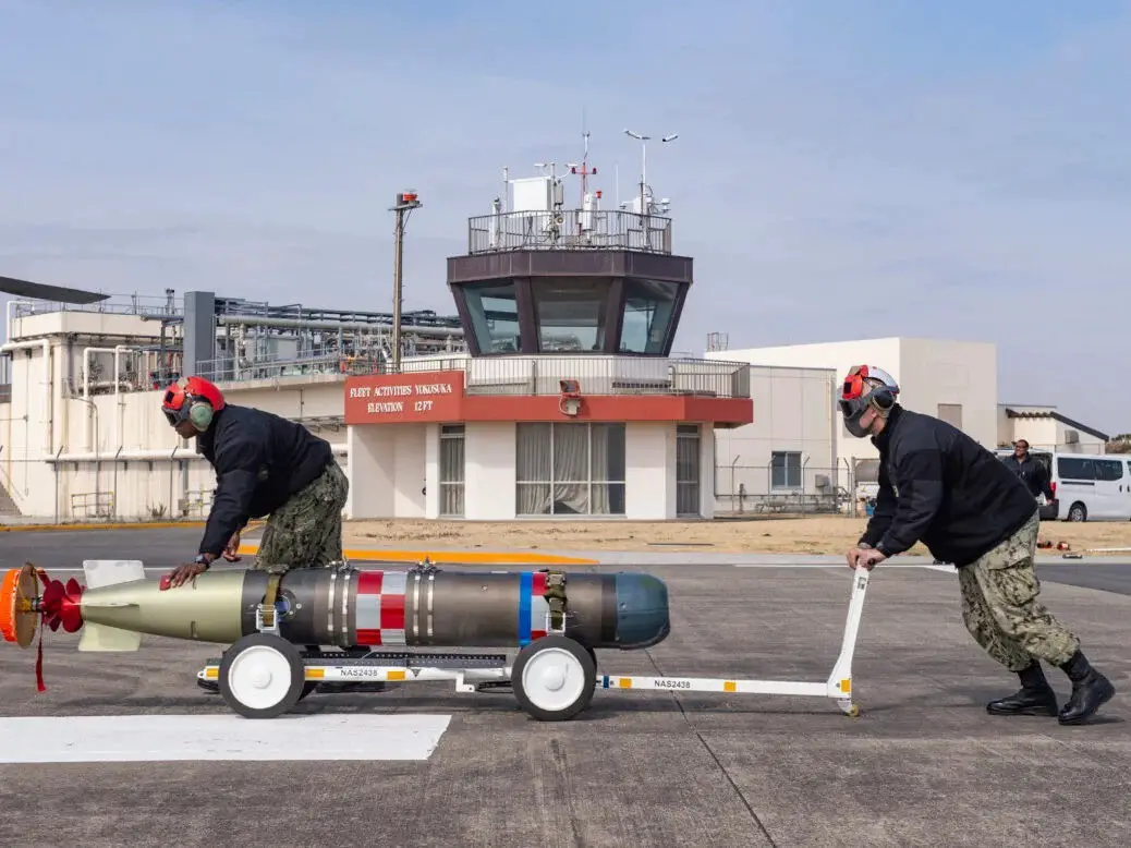 A MK 54 lightweight torpedo being transported for mounting on an MH-60R Sea Hawk.
