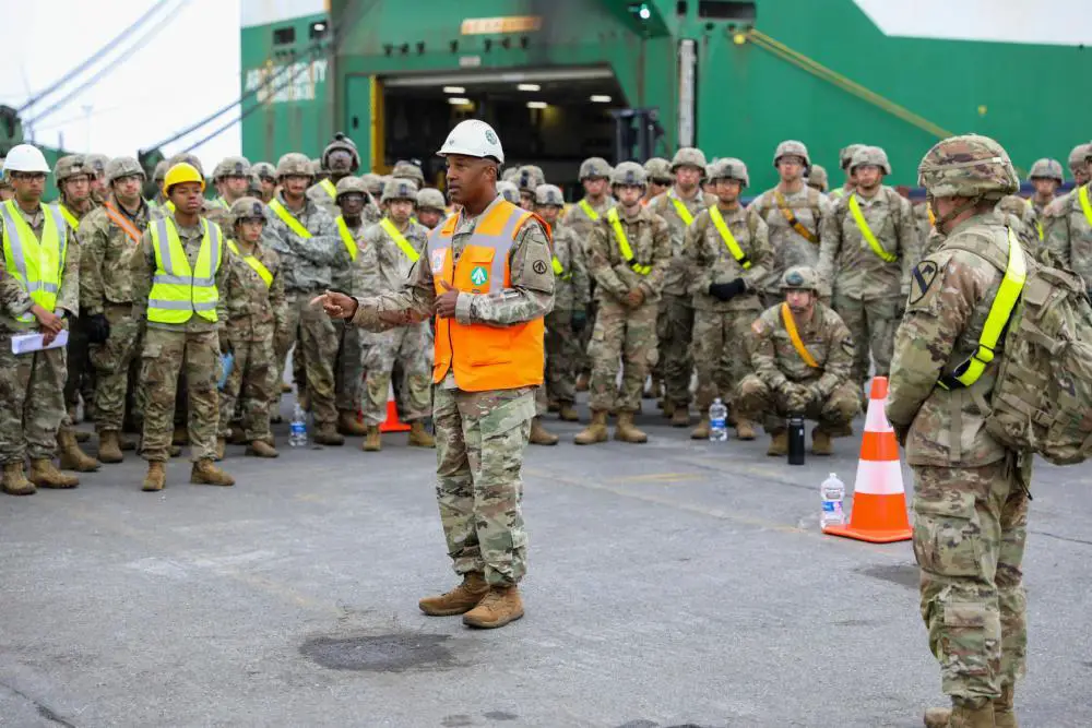 U.S. Army Lt. Col. J.D. Tillman, commander of the 838th Transportation Battalion, briefs Soldiers in front of ARC Integrity before they unload and stage equipment belonging to 3rd Armored Brigade Combat Team, 1st Cavalry Division in the port of Antwerp-Bruges, Belgium, July 21, 2022.
