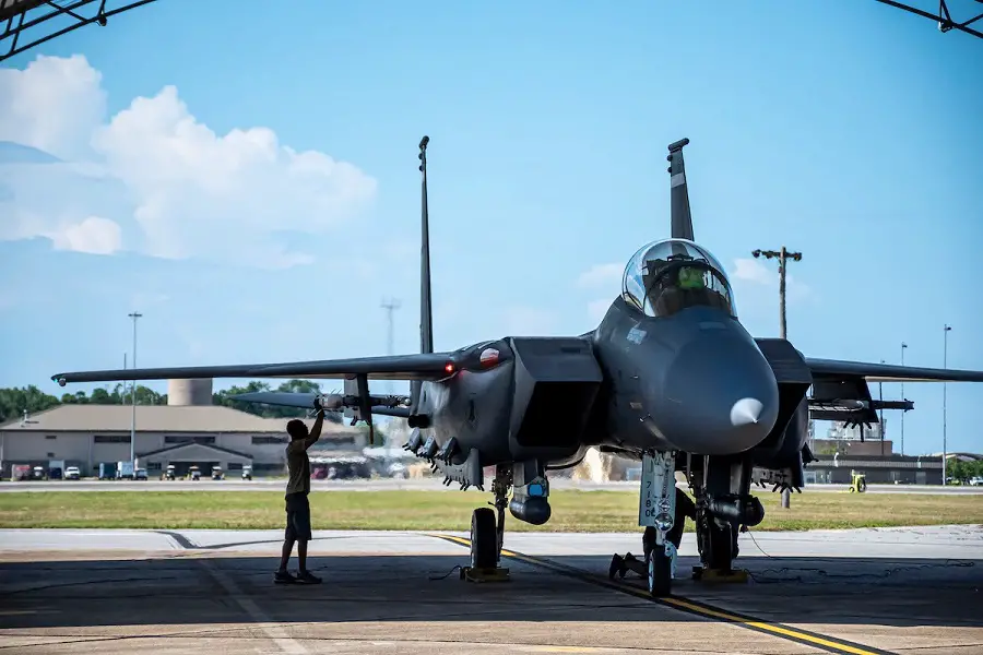 A maintenance support contractor checks the AIM-120D3 attached to an F-15E Strike Eagle as it prepares for a live-fire mission at Eglin Air Force Base, Fla., June 30, 2022.