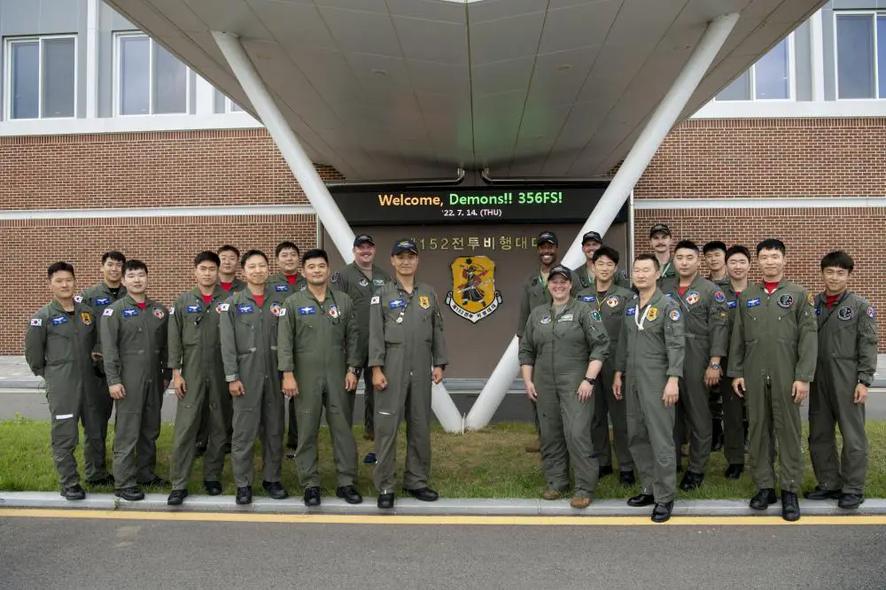 ROKAF F-35 pilots from the 152nd Fighter Squadron, stand in front of their squadron building with U.S. Air Force F-35 pilots at Cheonju Air Base, Republic of Korea, July 14, 2022.