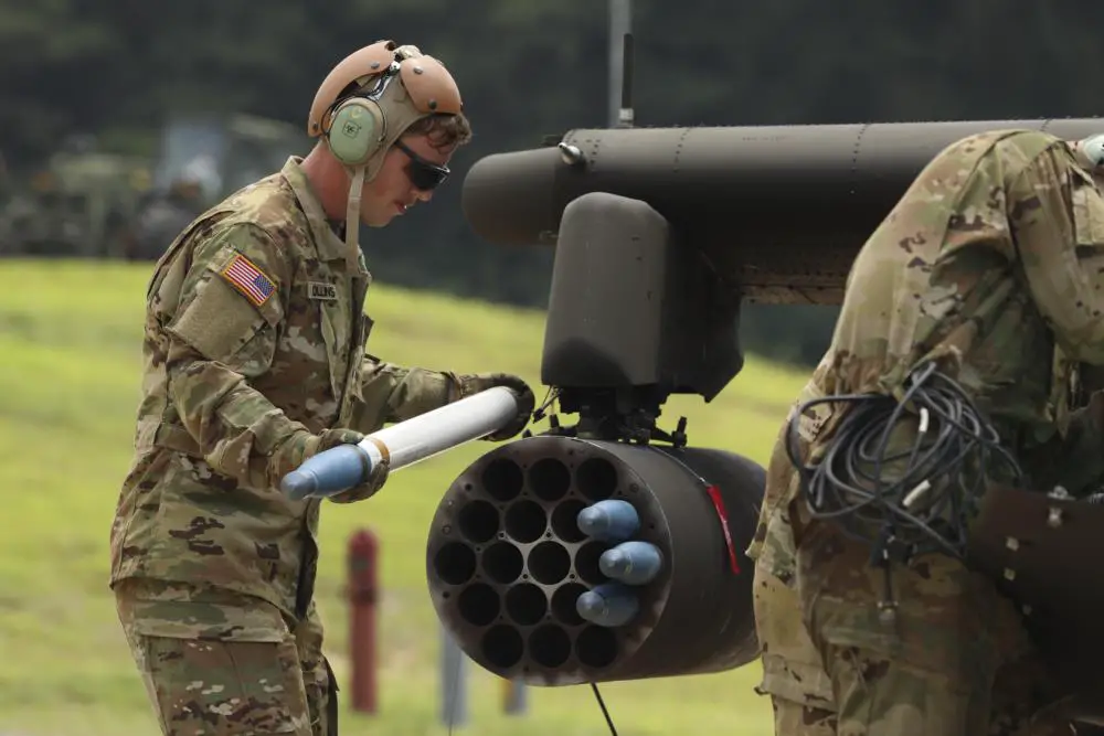 Soldier assigned to 5-17 Air Cavalry Squadron, 2nd Combat Aviation Brigade, 2nd Infantry Division, is seen loading a Hydra 70 missile into the AH-64E Apache Helicopter, July 19, 2022, Rodriguez Live Fire Complex, Republic of Korea.