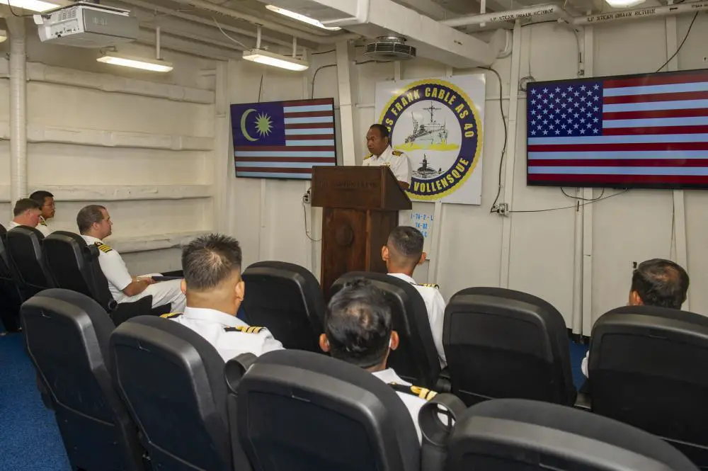 Royal Malaysian Navy Capt. Kamalrulzaman bin Zainul, acting Submarine Force Commander and commanding officer of Submarine Training Centre, gives welcoming remarks to assembled U.S. Navy and Royal Malaysian Navy officers in preparation for the 13th Royal Malaysian Navy and U.S. Navy Submarine Staff Talks to be conducted aboard the Emory S Land-class submarine tender USS Frank Cable (AS 40)
