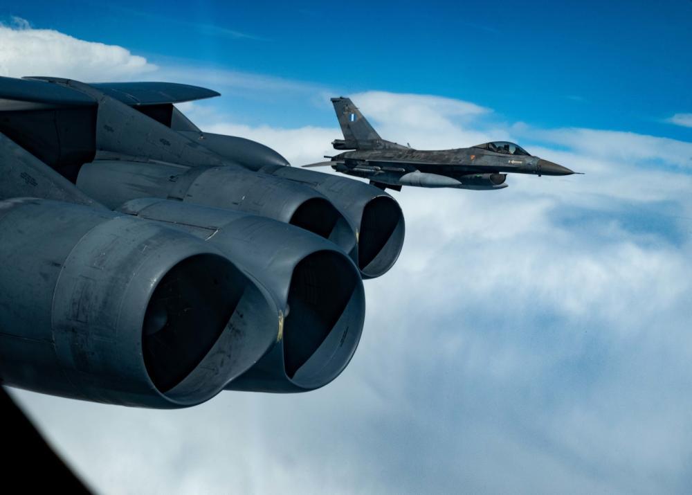 A Hellenic Air Force F-16 Fighting Falcon escorts a U.S. Air Force 23rd Expeditionary Bomb Squadron B-52H Stratofortress over Greece during a Bomber Task Force mission Aug. 26, 2022. 