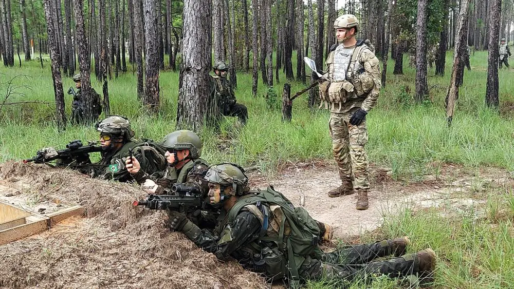 Soldiers from the 3rd Company, 5th Light Infantry Battalion (Air Mobile), Brazilian Army, execute a blank fire rehearsal to seize an enemy objective as part of a bilateral training exercise at the Joint Readiness Training Center at Fort Polk, La. U.S.