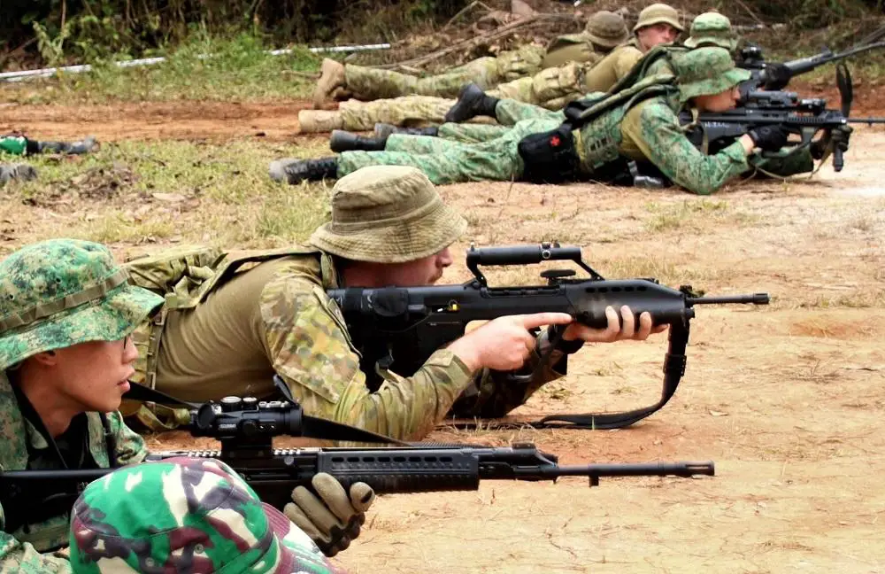 Army personnel conducting a rehearsal of tactical drills.