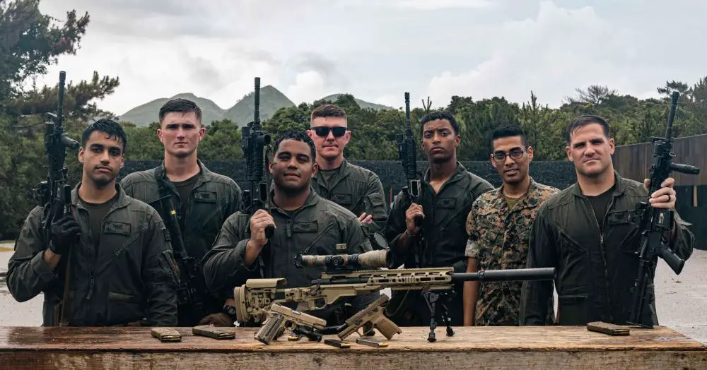 U.S. Marines and Naval personnel with Special Reaction Team, Headquarters and Support Battalion, Marine Corps Installations Pacific, pose for a photo during multiple weapons sustainment training on Camp Hansen, Okinawa, Japan, Aug. 11, 2022.