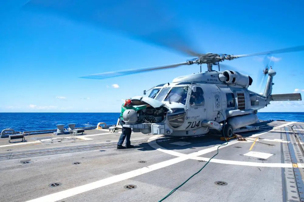 Aircraft Electrician’s Mate 2nd Class Sadie Hernandez performs a maintenance check on an MH-60R Sea Hawk helicopter, attached to Helicopter Maritime Strike Squadron (HSM) 48, on the flight deck aboard the Arleigh Burke-class guided-missile destroyer USS Truxtun (DDG 103), Aug. 13, 2022. 