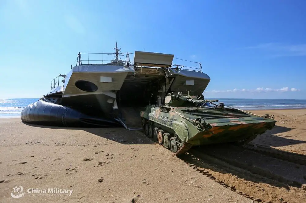 An armored vehicle rolls out of an air cushioned landing craft during a beach landing training exercise conducted by a naval landing ship flotilla under the PLA Southern Theater Command in mid-August, 2022. 