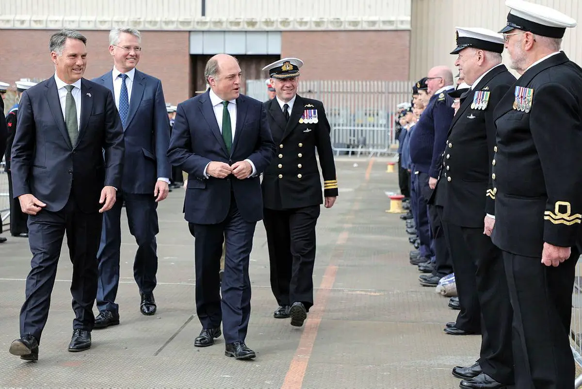 The Defence Secretary, Ben Wallace (right), the Deputy Prime Minister of Australia, Richard Marles (left), with Dr. Charles Woodburn CEO of BAE Systems (centre) at the commissioning ceremony of the fifth Astute Class submarine, HMS Anson in Barrow-In-Furness. Australian submariners to join Royal Navy crews as UK and Australia deepen defence ties through AUKUS pact. 