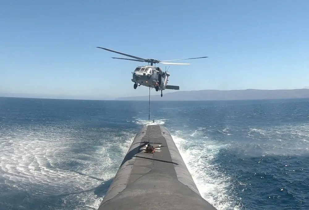 An MH-60R Seahawk helicopter, assigned to the “Wildcats” of Helicopter Sea Combat Squadron 23, delivers supplies to the ballistic missile submarine USS Nevada (SSBN 733) during a vertical replenishment at sea. Alabama is one of eight ballistic-missile submarines stationed at Naval Base Kitsap-Bangor, providing the most survivable leg of the strategic deterrence triad for the United States.