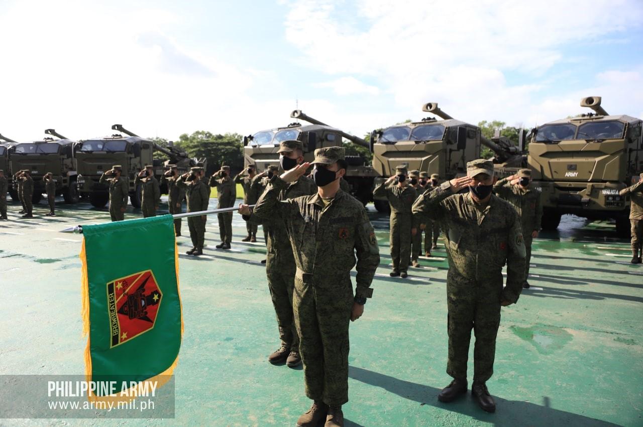 10th Field Artillery "Rolling Thunder" Battalion troops render a snappy salute during the send-off ceremony of their unit on September 21, 2022 at the Philippine Army Grandstand, Fort Bonifacio, Metro Manila.